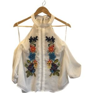 White blouse with embroidered flowers